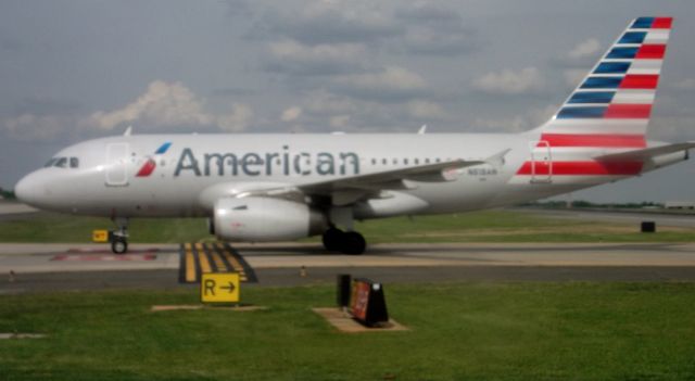 Airbus A319 (N818AW) - N818AW awaiting to cross an active runway after arrival from KALB...