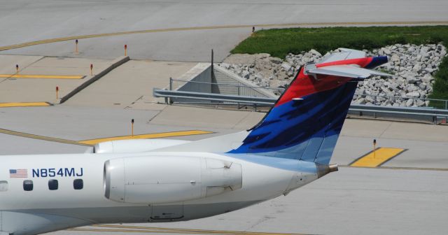 Embraer ERJ-145 (N854MJ) - Tail detail as N854MJ pushes back from the gate