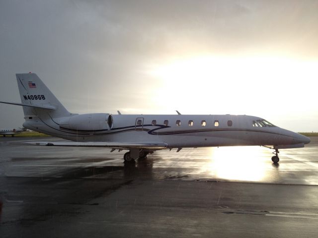 Cessna Citation Sovereign (N409GB) - Rain showers and sunshine helped package this shot of a beautiful Sovereign on the ground in Nashville, TN.