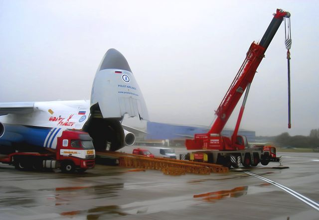 — — - Unloading heavy transport