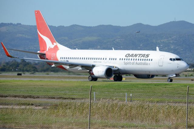 Boeing 737-800 (VH-VXN) - On taxiway heading for take-off on runway 05. Wednesday, 21st May 2014.