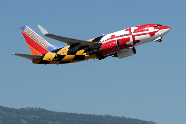 Boeing 737-700 (N214WN) - Not my first time catching Maryland One, but THIS time the midmorning weather conditions are perfect as it climbs out from Reno Tahoe Internationals runway 34L, so even tho there are already many pics of this a/c in the FA photo gallery, I selected it as my 99th submission.