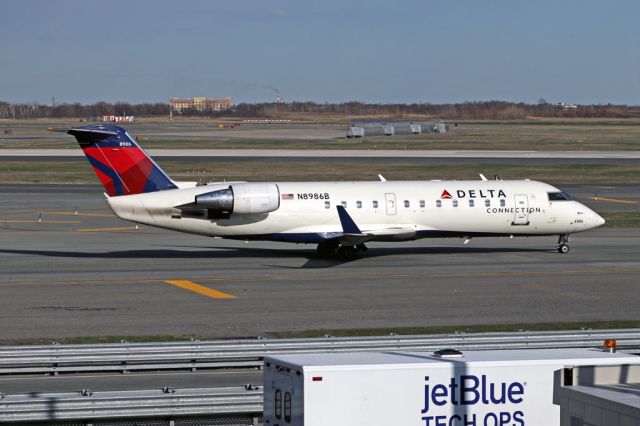 Canadair Regional Jet CRJ-200 (N8986B) - EDV4045 that must have been going the long way to get from the DL terminal to depart on 31L.