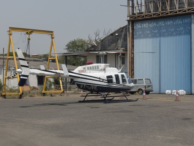 Bell 407 (VT-JVS) - 25 MAR 2018 in India. Busy heliport serving the offshore oil industry.