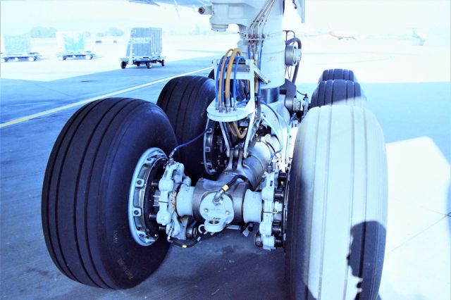 Boeing 777-200 (N775AN) - KSJC - Inaugural American Airlines 777-200 service San Jose, CA USA to Tokyo-Narita, (SJC-NRT) Japan on May 1, 1999. I was able to get Aircraft and ramp access for photos and videos of the departure with the help of a co-worker. This jet was less than 1-month old, and a side note I saw this jet at Boeing Everett in April 1999 undergoing flight test and also parked on the hard stand - just by chance when up visiting my Father and other relatives that year. Special thanks to Craig Curtis for the help with Ramp access and jet tour.   In this photo, I was being told how lucky I was to see such nice and clean landing gear, and this jet was less than 1 month delivered new to AA at DFW. Here is the proof shot! LOL!