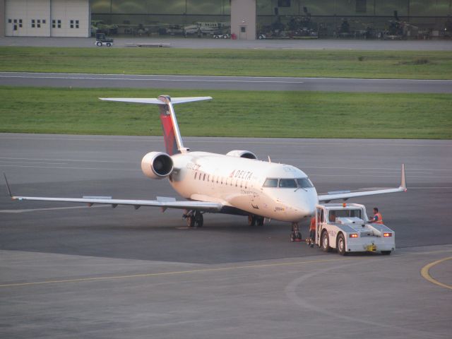 Canadair Regional Jet CRJ-200 (N8884E) - A Delta CRJ is pushed back from the gate at KALB.