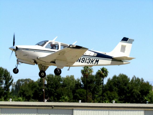Beechcraft Bonanza (33) (N913KM) - Taking off RWY 24