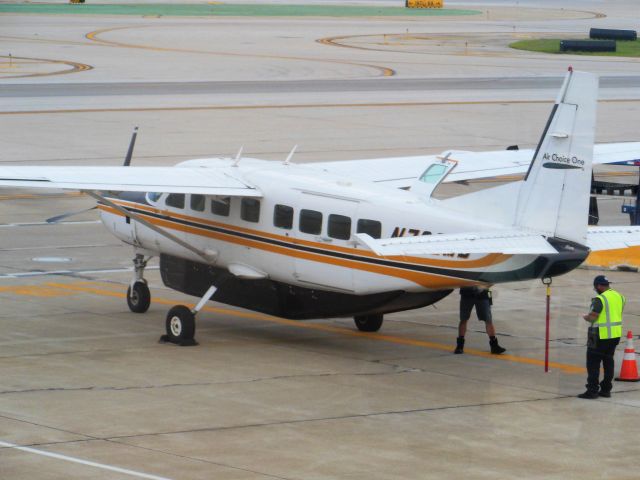 Cessna Caravan (N732MD) - Air Choice One (3E) N732MD Ce208B [cn1083]br /Chicago O’Hare (ORD). Parked on the ramp, this orange/white liveried Ce208B Grand Caravan is not in regular Air Choice One blue/white livery. br /Taken from the Terminal br /2015 07 15   a rel=nofollow href=http://alphayankee.smugmug.com/Airlines-and-Airliners-Portfolio/Airlines/AmericasAirlines/Air-Choice-One-3E/i-F2HDhG5https://alphayankee.smugmug.com/Airlines-and-Airliners-Portfolio/Airlines/AmericasAirlines/Air-Choice-One-3E/i-F2HDhG5/a