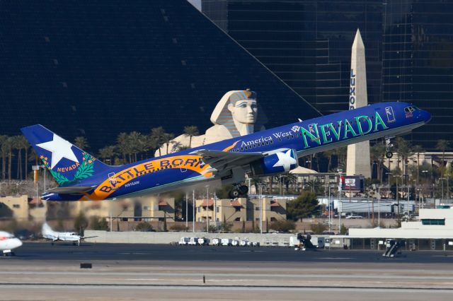 Boeing 757-200 (N915AW) - America West N915AW "Nevada" (FLT AWE320) climbing out from RWY 01R enroute to Chicago O'Hare Int'l (KORD). [Photo taken 12-29-2006, KLAS]