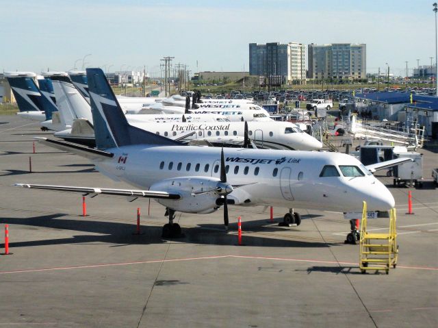 Saab 340 (C-GPCJ) - Westjet Link aircraft lineud up at YYC (recently transferred from pacific Coastal Airlines so they have not repainted all of them yet) 