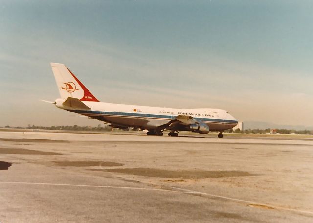 Boeing 747-200 (HL7410) - Korean Air B-747 ready for take off at KLAX spring of 1977. Note the "I Love NY" sign behind the wings.