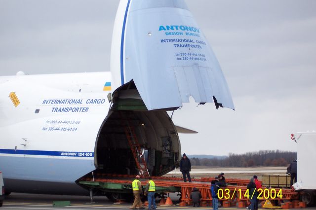 Antonov An-124 Ruslan — - Closer look at ramp preparations for loading of heat exchange unit to go overseas. Again - apologies for silly date stamp!