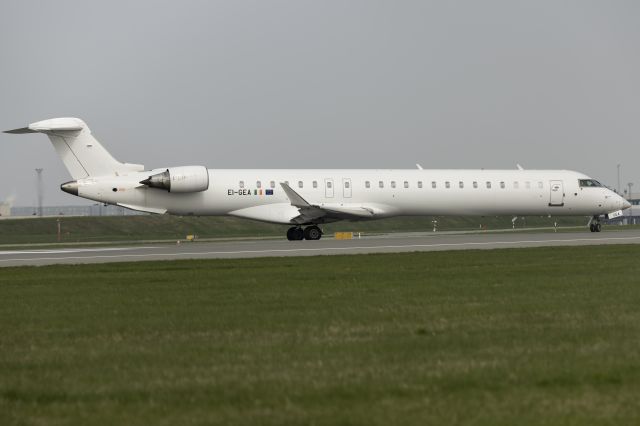 Canadair Regional Jet CRJ-900 (EI-GEA) - East of runway R04