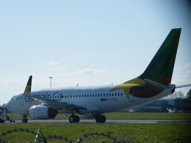 Boeing 737-700 (TJ-QCA) - TJ-QCA B737 UNDER TOW AGAIN ON 16-03-2011 ON THIS SIDE OF PLANE THE PRIDE OF CAMEROON IS WRITTEN IN FRENCH AND ON OTHER SIDE IT IS ENGLISH