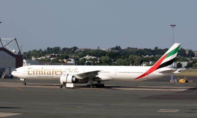 BOEING 777-300ER (A6-ECW) - Left engine being worked on after it caught fire after landing.