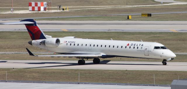 Canadair Regional Jet CRJ-700 (N751EV) - Taxiing to gate after arrival on Runway 4.