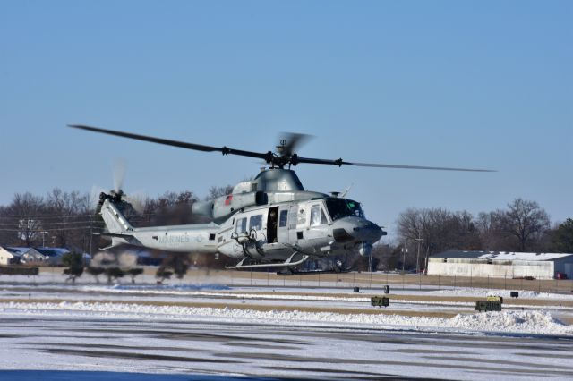 — — - A Huey departing from the ramp