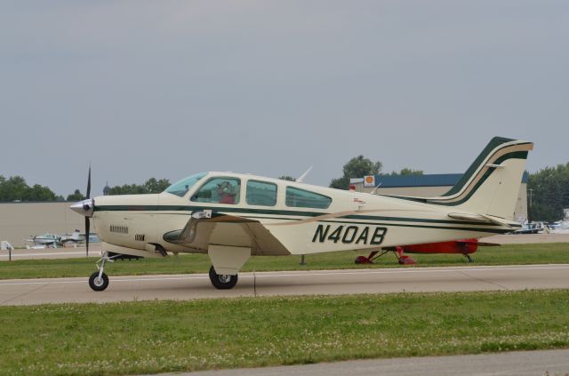 Beechcraft Bonanza (33) (N40AB) - Bonanza Mass Arrival at Oshkosh AirVenture 2014.