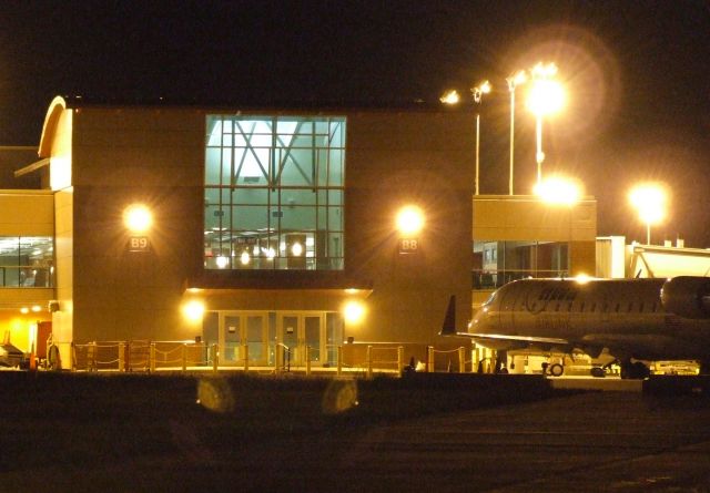 — — - The ramp side of the passenger terminal at KLEX.