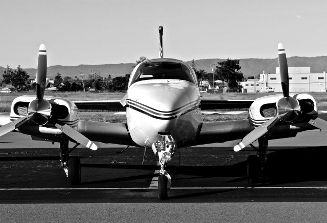 Beechcraft 55 Baron (N1835B) - Very sleek looking Baron 55 parked on the transient ramp a few hours prior to departure. 