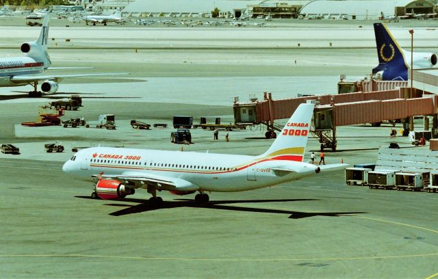 Eurocopter AS-350 AStar (C-GVXA) - KLAS - top floor of the parking structure at LAS-Las Vegas is a great place to photograph airliners, especially when the temperature is over 115! CANADA 3000 Charter pulling away from the Intl Terminal, this may be July 1995 - I don't have a date on my photo negative sleeve.
