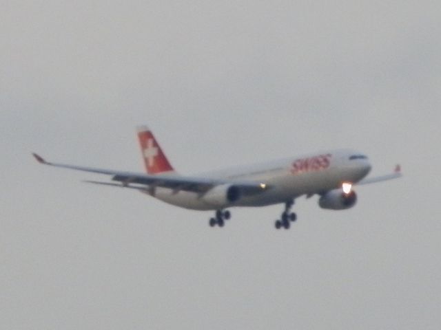 Airbus A330-300 (HB-JHK) - On final approach at dusk!