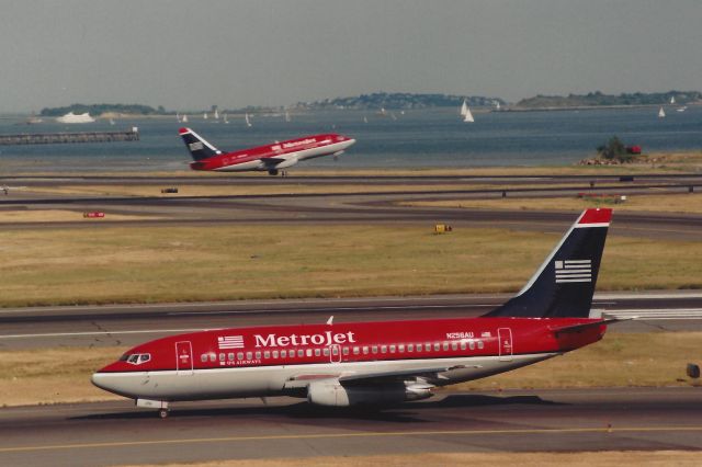 Boeing 737-200 (N256AU) - From June 1999 - One Metrojet departs 22L hile another taxis for departure at BOS!