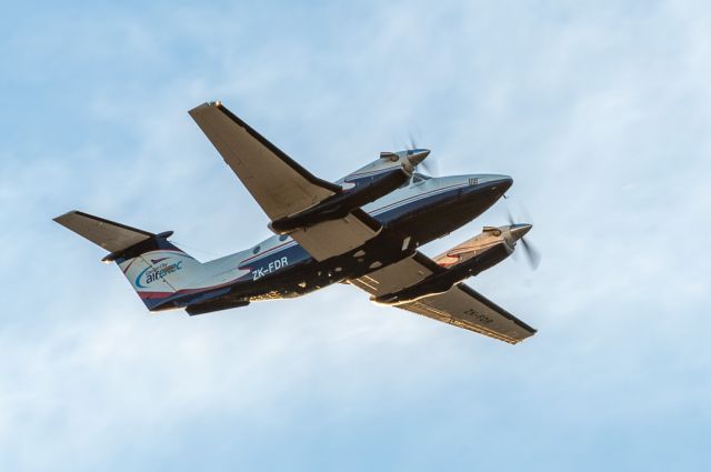 Beechcraft Super King Air 200 (ZK-FDR) - The "Flying Doctor" King Air 200, FDR climbing away from Runway 02 bound for Dunedin on Friday 17 March 2017. The setting sun is reflecting nicely off the wing trailing edge, which is just below this shot.