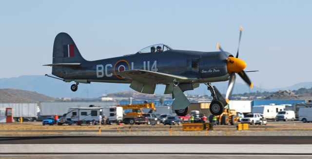 North American Fury (N19SF) - Race 114, "Argonaut," a Hawker MKII Sea Fury piloted by Sherman Smoot of Templeton, CA, is seconds from landing on Reno Stead's Runway 26 after completing yesterday's final race of the day ... an Unlimited Class race that was won by another Hawker Sea Fury, "Dreadnought."