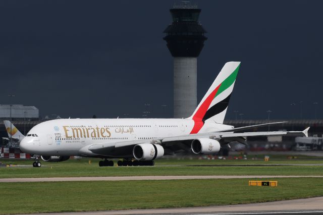 Airbus A380-800 (A6-EEW) - UAE17 arriving against a background of dark skies.