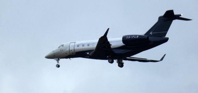 Embraer Legacy 550 (XA-FLB) - About to touch down is this 2017 Embraer Legacy 550 in the Winter of 2024.