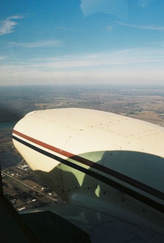 Piper PA-30 Twin Comanche (N8558Y) - Photo view of the Acadiana area of Louisiana from over the starboard Lycoming engine of a beautiful Piper PA-30 Twin Comanche, msn 30-1705, manufactured in 1968, with FAA registration N8558Y.br /br /Flight was local, from KLFT, Lafayette Regional Airport towards KARA, New Iberias Acadiana Regional Airport and return. The C-47/DC-3 N33VW had taken off from KLFT right behind us and we caught a view of that aircraft on final to KARA - a short hop.br /br /Photo circa 2000, Canon camera and 35mm film.