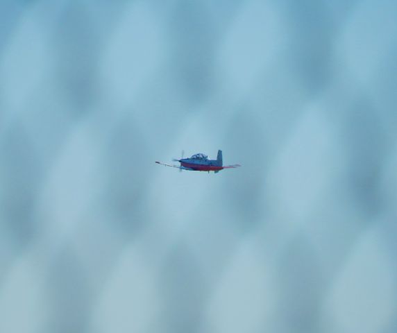 North American T-6 Texan — - US Navy trainer Beechcraft T-6 Texan II through chain link fence 