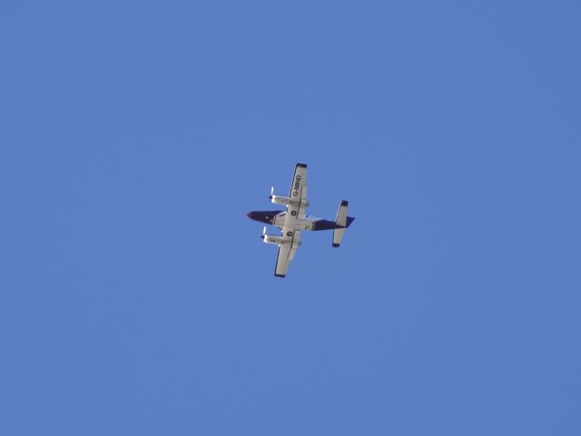 Cessna 404 Titan (G-MIND) - Environment Agency Geomatics Cessna 404 Titan G-MIND flying over Weymouth 