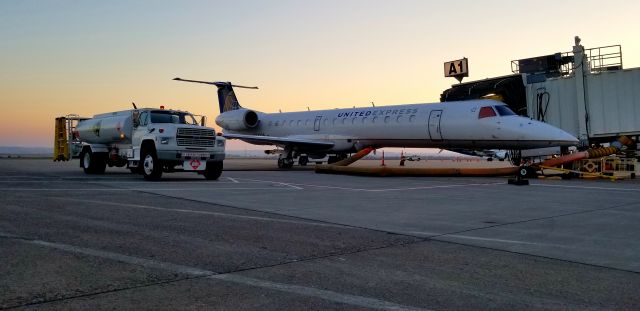 Embraer ERJ-145 — - Fueling United Express on a Beautiful Billings Morning!