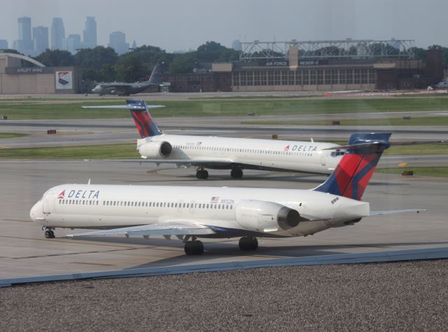 McDonnell Douglas MD-90 (N915DN) - Passing N925DN on Ramp at MSP on 07/31/2011