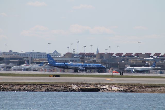 Embraer ERJ-190 (N304JB) - JetBlue Embraer 190 in a special livery taxis off of 4R at Logan. Unsure of what this paint scheme is called, but it looks a lot like a blueprint.