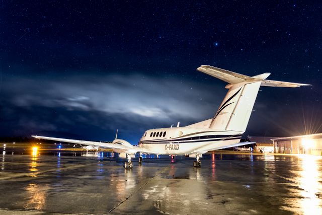 Beechcraft Super King Air 200 (BXH151) - Early medevac call to Cranbrook BC CYXC. Almost clear night on the ramp. You can see the little bit of cloud in the distance. 