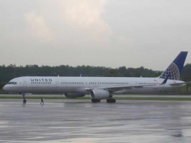 BOEING 757-300 — - Rainy day at gate