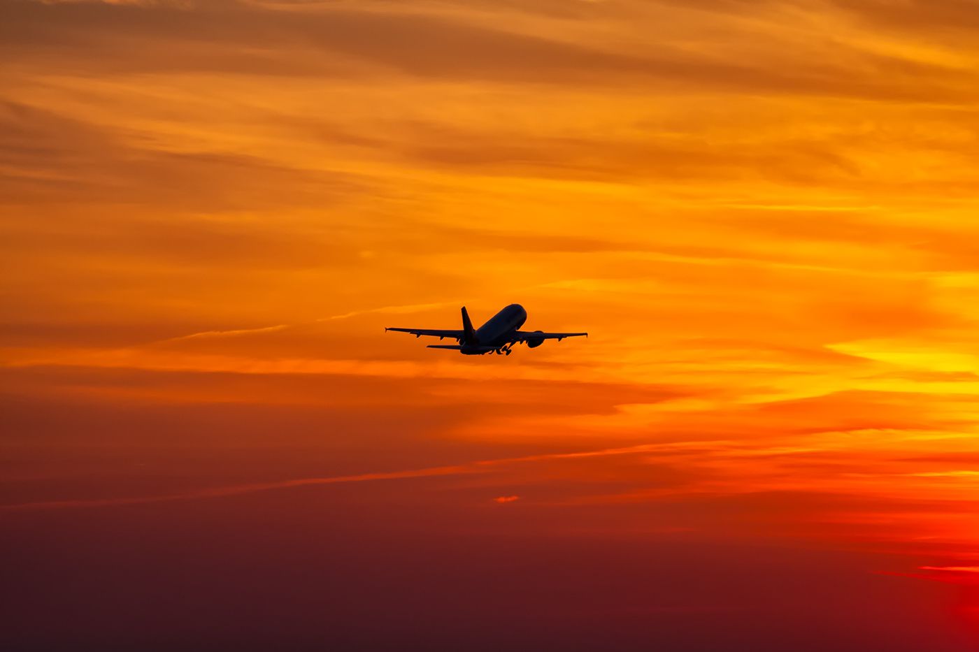 Airbus A319 (D-AGWE) - D-AGWE departing into a beatiful lit sky.