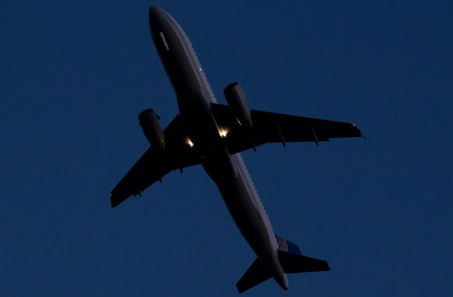 Airbus A320 (N459UA) - Climbing out from runway 23 in the final few moments of dusk light. Had it departed five minutes later, full nighttime darkness would have made it impossible for me to be able to get the UA logo on the tail.br /Sincere Thanks to the NFTA (Niagara Frontier Transit Authority) officer for his friendship and understanding. And equally sincere Thanks to the Rogers Drive resident who allowed me to use his property so I could walk over and position at the third-best of KBUFs fourteen superb spotting locations.