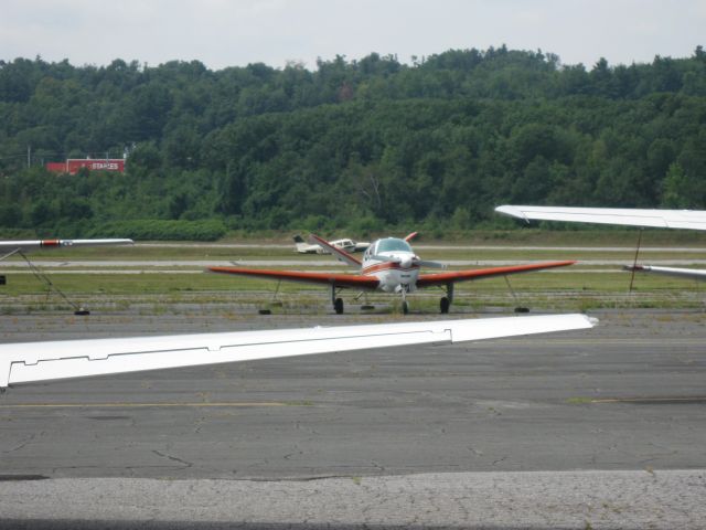 Beechcraft 35 Bonanza (N5974C) - Bonanza V35 with a Cherokee in the background doing touch-and-goes