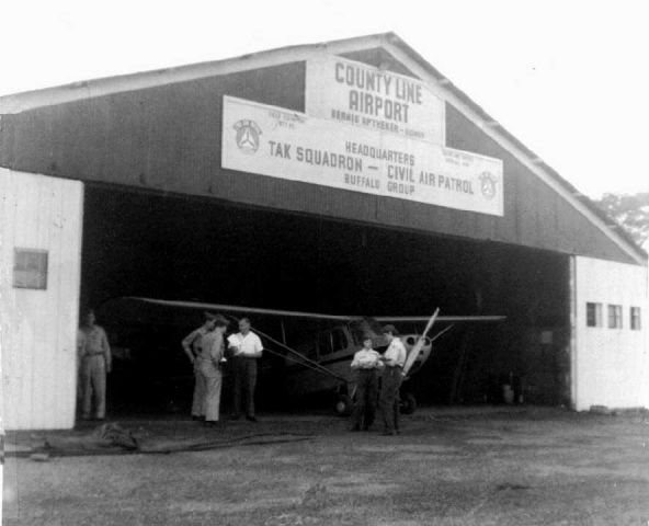 — — - scanned from old photobr /County Line Airport mid 1950sbr /Civil Air Patrol Headquarters for WNYbr /TAK Squadron (Tonawanda, Amherst, Kenmore)br /br /Aeronca Champion in hangar