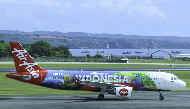 Airbus A320 (PK-AXD) - Here is an Air Asia A320 pulling into its gate in Bali shot from the terminal!