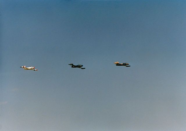 Lockheed T-33 Shooting Star — - Flight of 3 private owned T-33s doing a fly by at the EAA Fly In in a in trail formation