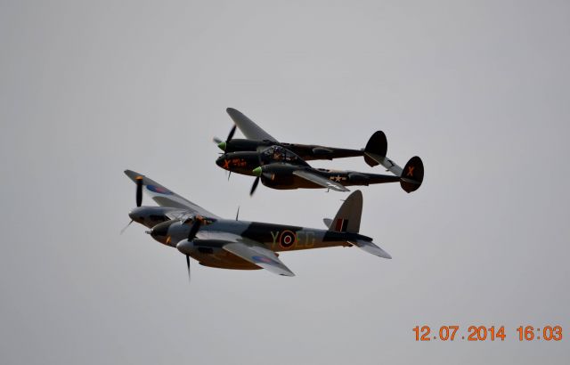 — — - A P38 Lightning and a British Mosquito fly formation at the Geneseo Airshow!