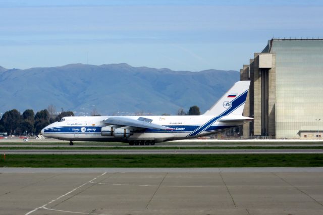 Antonov An-12 (RA-82045) - Engine reversers deployed.  Passing Moffett Hangers #2 and #3.