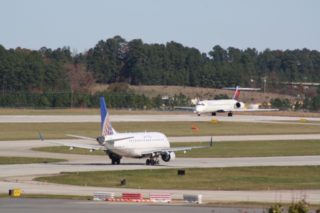 McDonnell Douglas MD-90 (N964DN) - N964DN starts its takeoff roll from runway 23R as N631RW taxis out