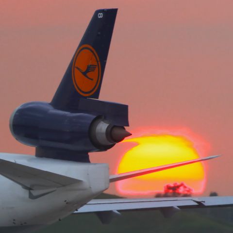 Boeing MD-11 (D-ALCD) - It looks like that the engine is absorbing the sun.