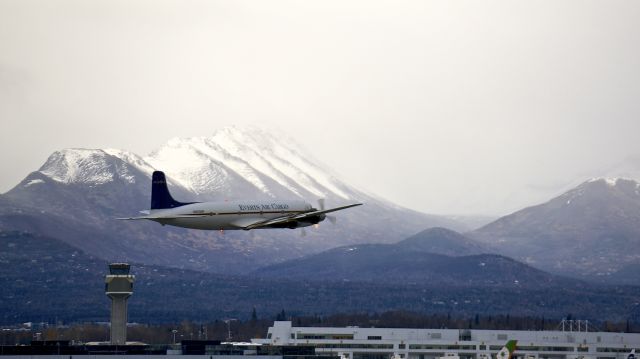 Douglas DC-6 (N9056R) - Shot from the West Access Road at the approach end of RWY 15; Ted Stevens Anchorage International Airport; Anchorage, Alaska, USA